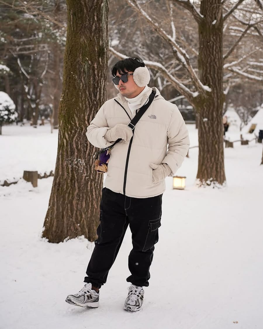 Dexter Ian Mallari among snowy trees in South Korea, travelling with Avian Summit Travel